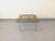 Vintage square coffee table from the 1970s, in the style of Florence Knoll or Milo Baughman, with a square smoked glass...