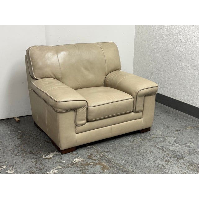 Design Plus Gallery presents a Lounge Armchair from Zhejiang Trayton Co. Beige leather upholstery is accented by...