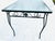 70's Midcentury Black Wrought Iron Outdoor Texture Glass Top Table In very good condition. 48"L X 30"D X 29.5"H Knee H 25"
