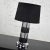 Handsome Art Deco style cylindrical table lamp with black and chrome horizontal stripes and a black drum shade. This lamp...