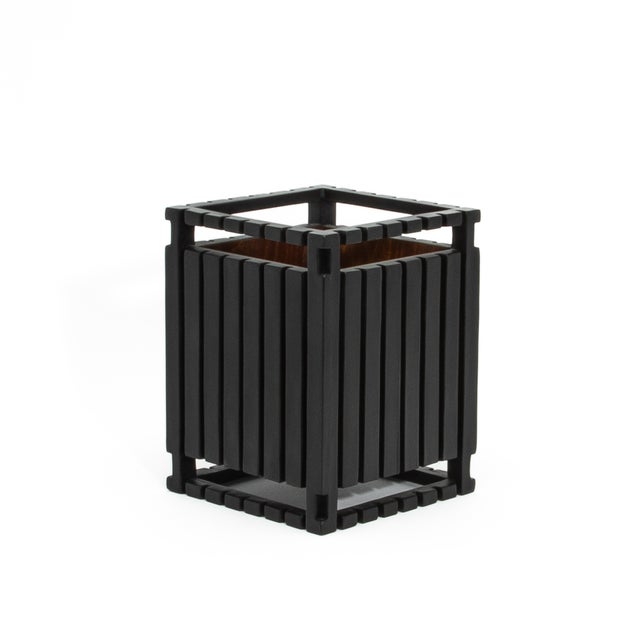The Black Oak Detail Waste Bin by R&Y Augousti exemplifies understated luxury, blending meticulous craftsmanship with...