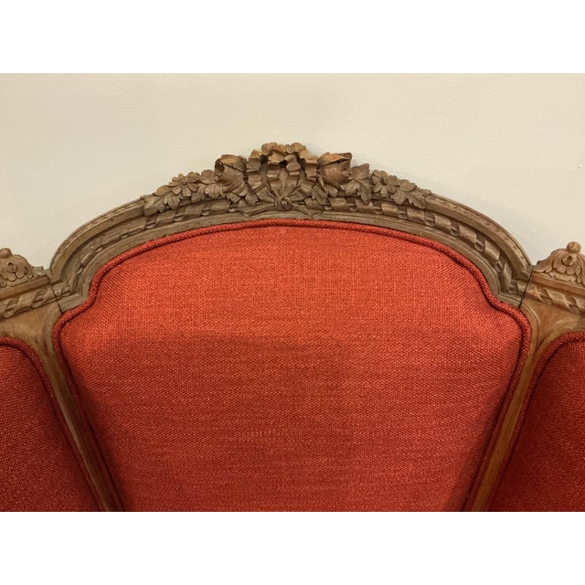 This extremely comfortable armchair has been recently upholstered in a warm red fabric. Beautiful, inviting addition to...