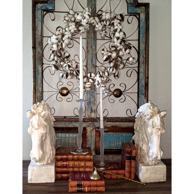 A striking and increasingly difficult-to-find pair of authentic Orrefors "Celeste" candlesticks designed by renowned...