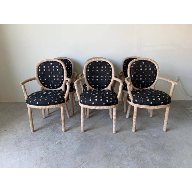 Elegant set of six 1970s Italian dining chairs by Marcello Mioni, showcasing beautifully carved wood frames with a...