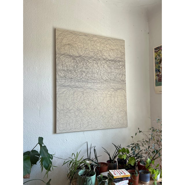 The artist made circular and straight line motions with pens as the canvas lay on the ground. This is part of the artist’s...