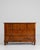 A refined example of Biedermeier craftsmanship, this 19th-century French chest of drawers embodies the movement's...