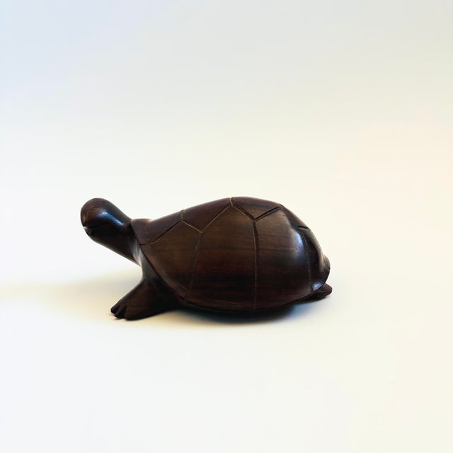 A vintage carved ironwood turtle. Great detailing to the turtle's features with a lovely dark natural grain. Measures...