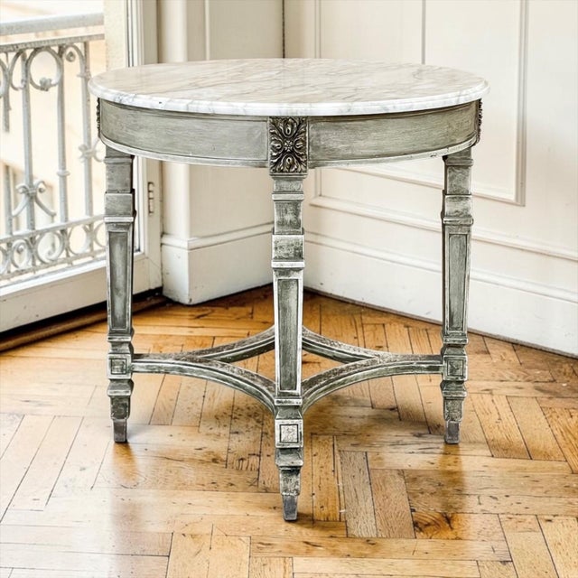 A refined example of late 19th century French neoclassical design, this antique round guéridon combines graceful...