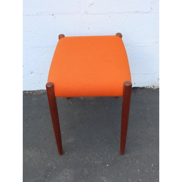 This stool is made of solid wood, and upholstery. it was made by JL Moller in Denmark and it is stamped. This Stool has a...