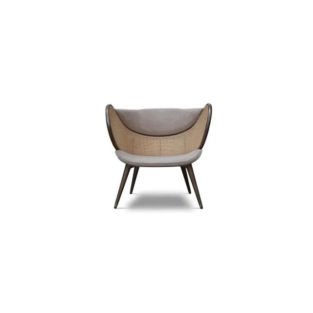 The Mudhif armchair, which empowers stunning and contemporary interiors, has a uniquely shaped backrest. This set of two...