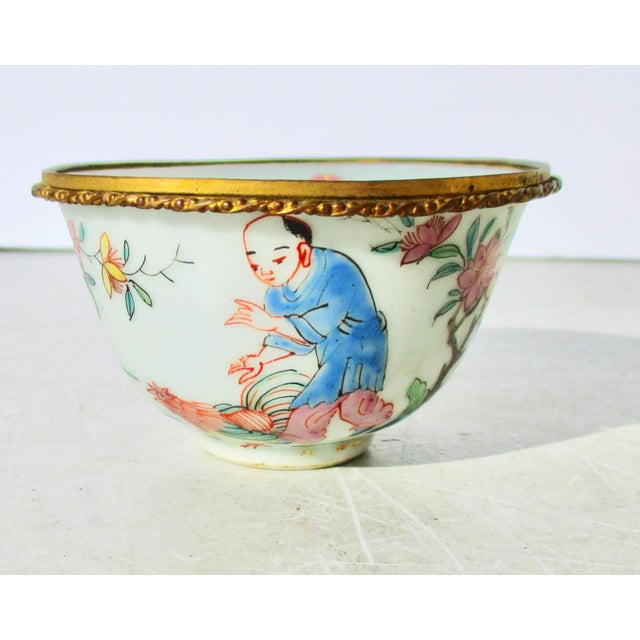 Antique Chinese Porcelain cup with gilt rim mount. Beautifully painted scene around the outer walls. The outer wall has...