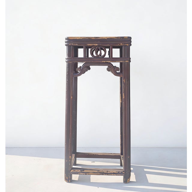 This 19th century pedestal table features a tall, slender silhouette constructed from solid elm with tenon and mortise...