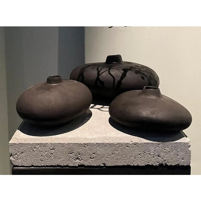 Set of 3 patinated bronze object 01 by herma de wit limited edition of 30 + 3ap pieces. Dimensions: small: d 9 x w 17 x h...