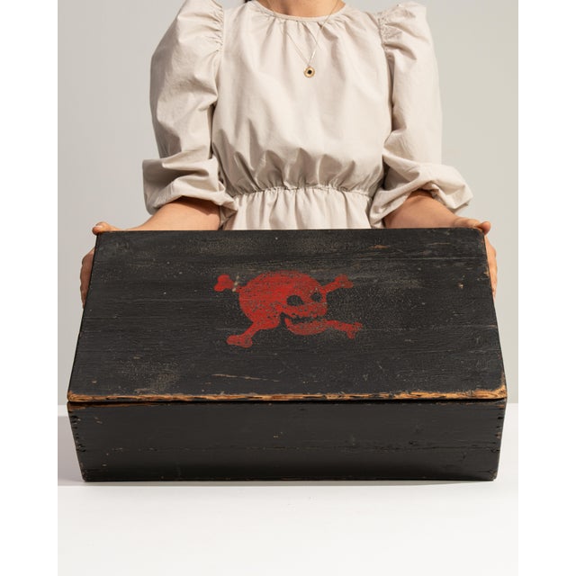 This 19th century box from France is finished in black, worked in wood. Its form follows honest, well-proportioned lines...