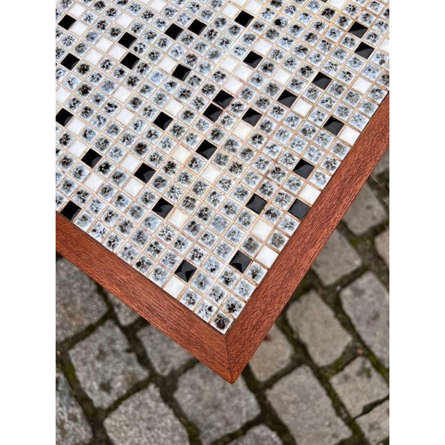 This striking sideboard is a captivating design that combines the classic elegance of teak with a functional and...