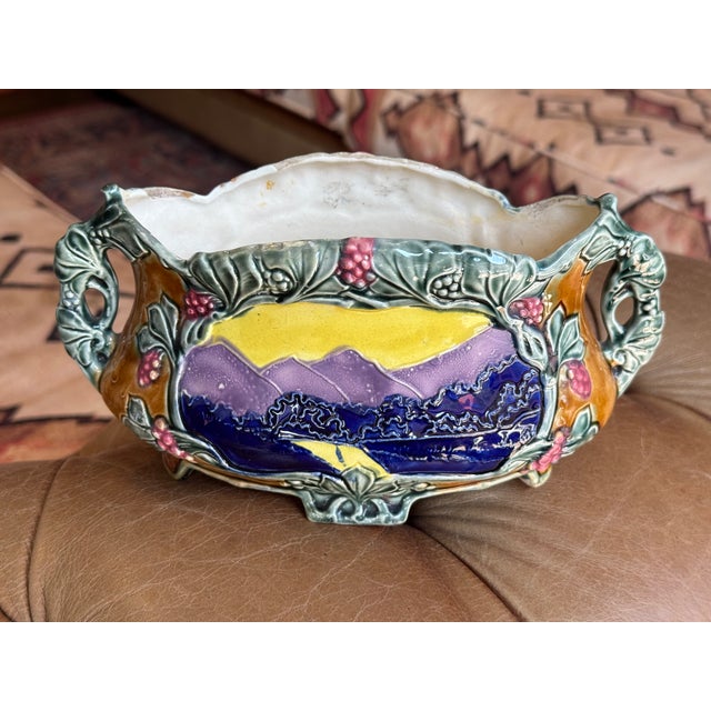 Antique French Majolica ceramic jardiniere style vase in Art Nouveau style. Beautiful, vibrant colors! This vase features...