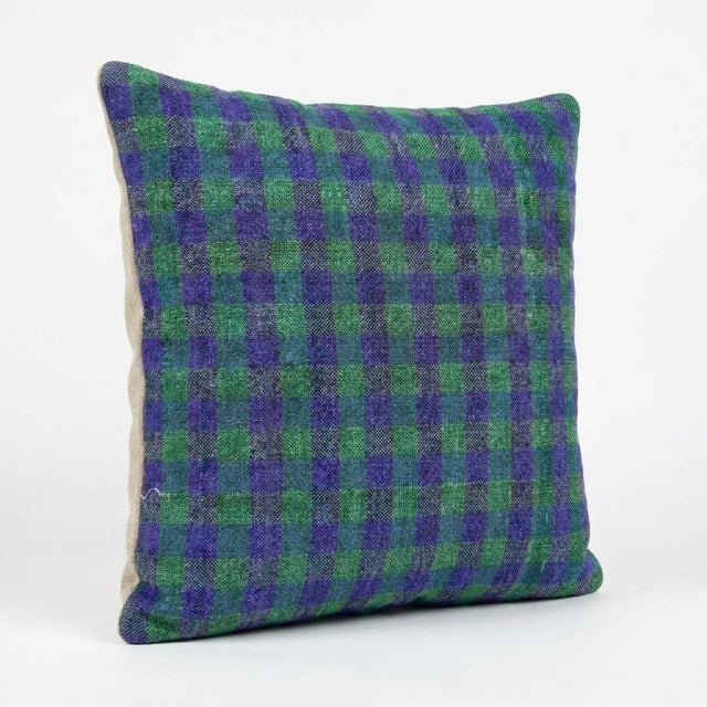 This beautiful 16'' x 16'' pillow cover was made from an authentic Turkish rug. Bright colors of wool adorn the front of...