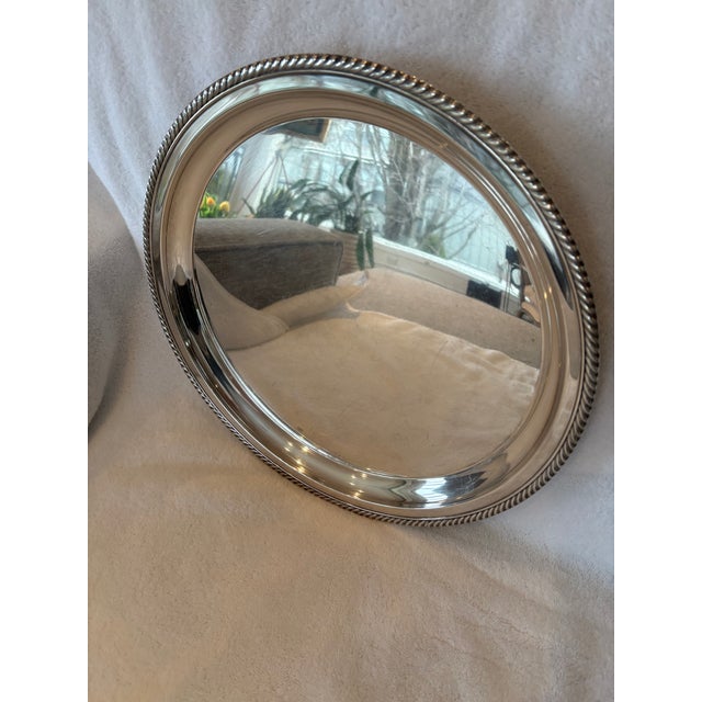 This Sterling Silver Gorham round platter has an elegant decorative trim making it a desirable addition to your collection...