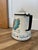 This item is a vintage Berggren enamel Swedish coffee percolator featuring a vibrant folk art design. Enamelware with a...