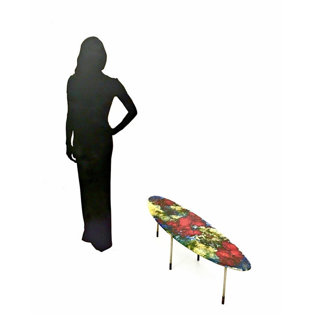 Made in Italy, 1960s. This beautiful and unique coffee table features a nickel-plated metal structure and a lacquered...