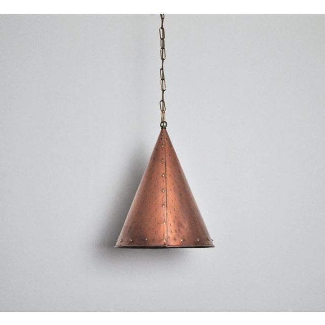 Handcrafted Danish cone shaped copper pendent lamp by Th. Valentiner. Beautiful brass details. Made in Denmark in the...