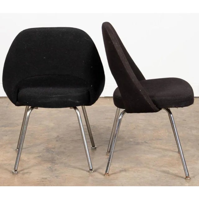 A pair of 1970s armless Executive Chairs Attributed to Saarinen and made by Knoll. The chairs have the original black...
