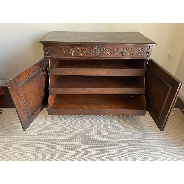 Carved oak 19th Century Jacobean sliding shelve dresser. Also works as a sideboard. Amazing condition.This belonged to my...