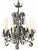 Large and heavy French-style wrought iron and tole chandelier featuring elaborate scrolling metalwork and dimensional...