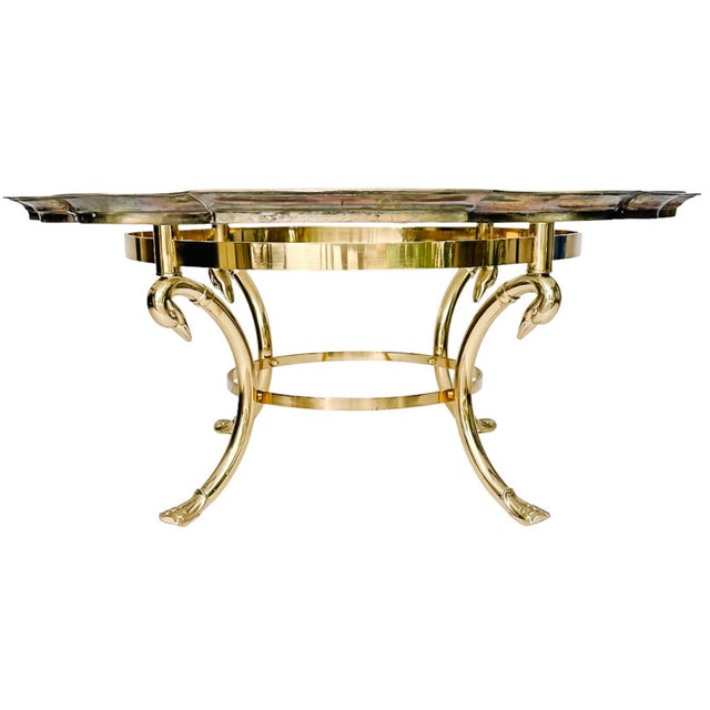 This striking Hollywood Regency coffee table in the style of LaBarge is a conversation piece. The base features three...