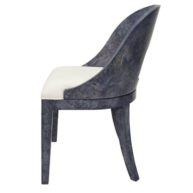 Designed to be admired from every angle, the Rafferty NVYBW dining chair pairs a sweeping curved back with the visual...