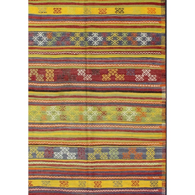 Measures: 5'5 x 7'10. Vintage Turkish Kilim Rug in Yellow, Red, Green, and Blue with Tribal Motifs. Keivan Woven Arts /...