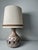 Ceramic mood lamp with two light fittings. Beautiful decor of a leaf motif. The light point and the openings in the lamp...