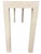 Unmarked off-white console table with a wood frame and a white, textured surface applied over top the wood as a decorative...