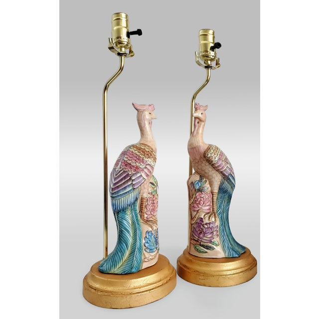 Offering a beautiful pair of RESTORED vintage Chinese hand painted porcelain phoenix figurine table lamps, circa Mid 20th...