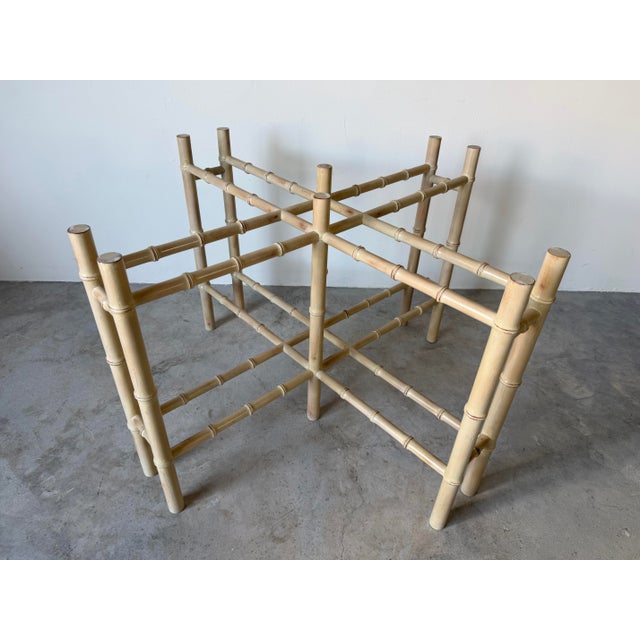 Elegant 1980s Hollywood Regency dining table base featuring a sculptural faux-bamboo carved wood construction in a warm,...