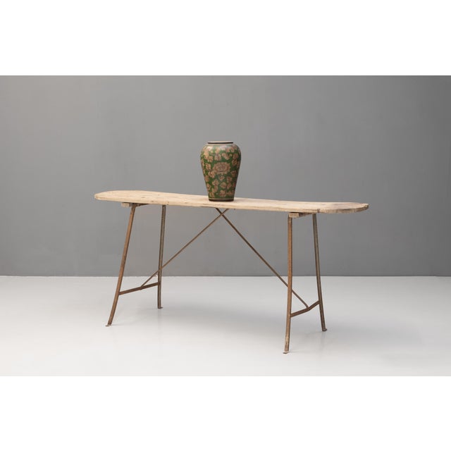 French wash table with poplar top on a metal frame base. Circa 1900.