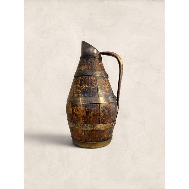 Barrel-shaped and copper-bound, this oak staved wine jug carries the quiet weight of rural French working life. Vessels...