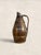 Barrel-shaped and copper-bound, this oak staved wine jug carries the quiet weight of rural French working life. Vessels...