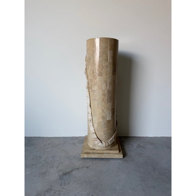 A striking vintage tessellated stone pedestal executed in the style of Maitland Smith, featuring a tall cylindrical form...