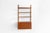 This modular wall unit in teak has one drawer cabinet and three bookshelves. Always adaptable and further expandable.