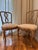 A set of ten late 19th century Italian dining chairs in the Louis XV taste, with sculptural interlaced backs, serpentine...