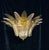 Italian flush mount shown in clear and smoky Murano palmette glass leaves, mounted on gold finish metal frame / Made in...