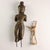 Bronze sculpture of a Bodhisattva. He is depicted standing bare-chested, wearing a draped dhoti and a decorated waistband...