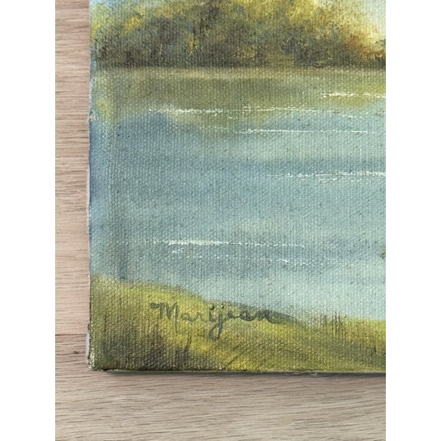 A charming, small vintage original landscape oil painting on canvas, signed lower left. This serene lakeside scene...