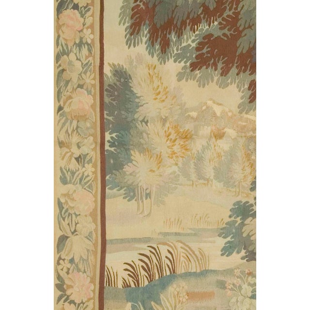 A charming example of 19th-century French craftsmanship, this wool and silk verdure tapestry features a tranquil woodland...