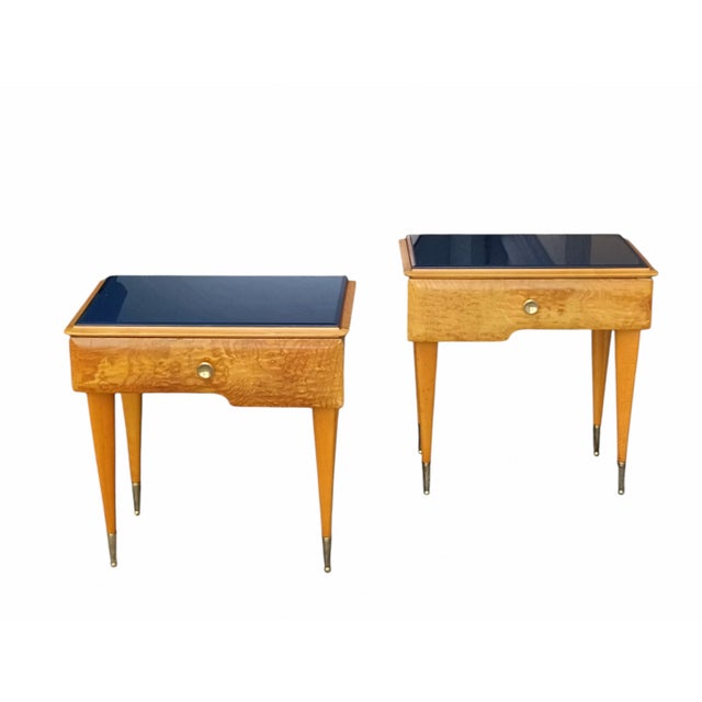 A splendid pair of mid-century modern bedside tables dating from the 1950s, crafted from briar wood with warm golden hues...
