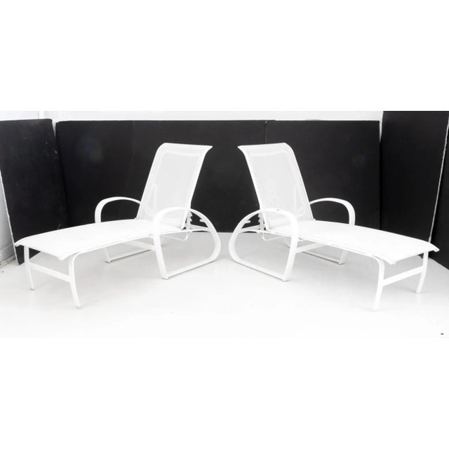 Set of Four Brown Jordan Outdoor Chaise Longues, label to reverse, white patinated with arms and adjustable backs. Back...