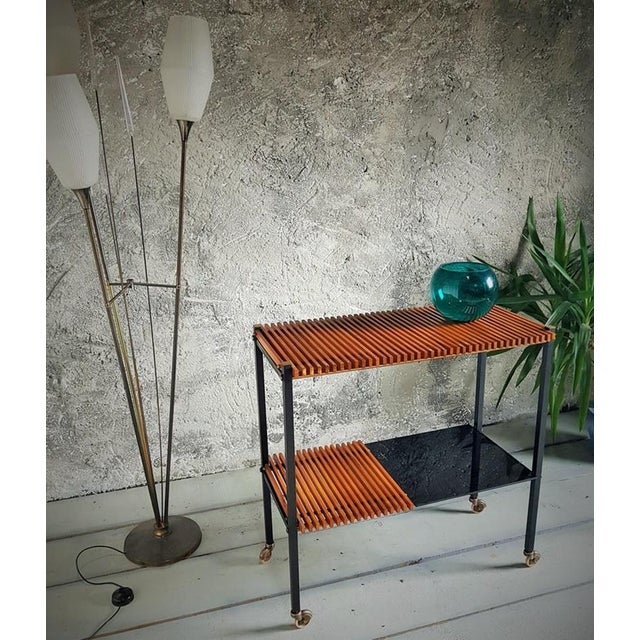 Danish Mid-Century Barwagen from the 1950s. The serving car has a metal frame, a glass plate and teak slats.