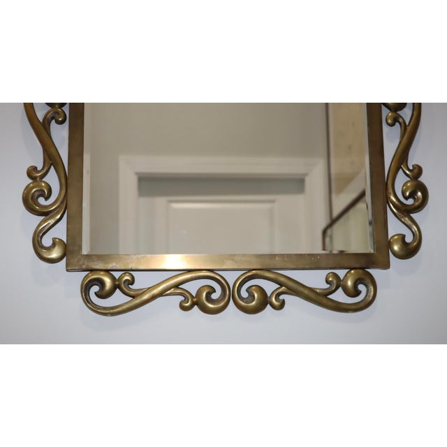 Beautiful 1970's patinated brass French wall mirror, in vintage original condition, with some wear and patina due to age...