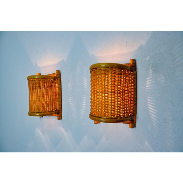 Very beautiful pair of rattan wall lights designed and produced in France in the 1960s. An organic design that will...